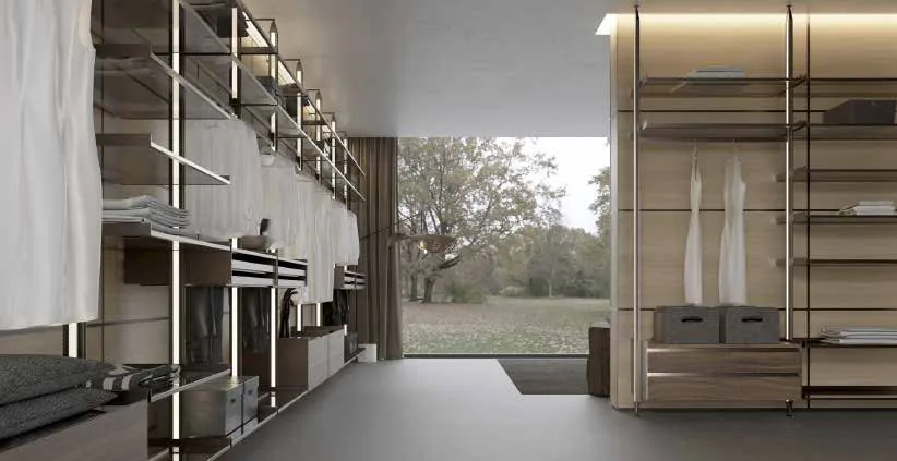 Walk-in wardrobe with brass rails